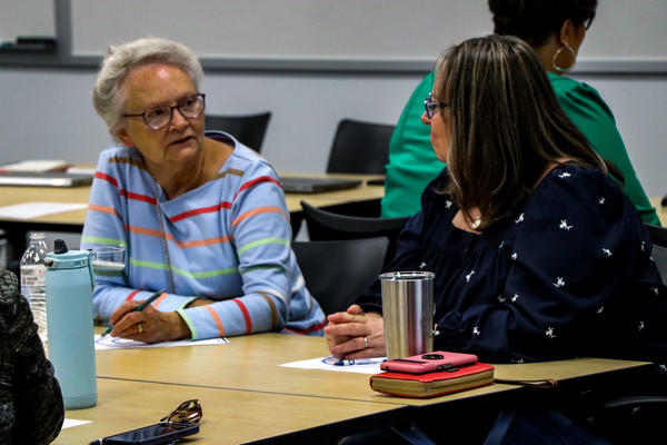 employees having a discussion at a table